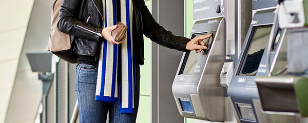 Person using a myki machine